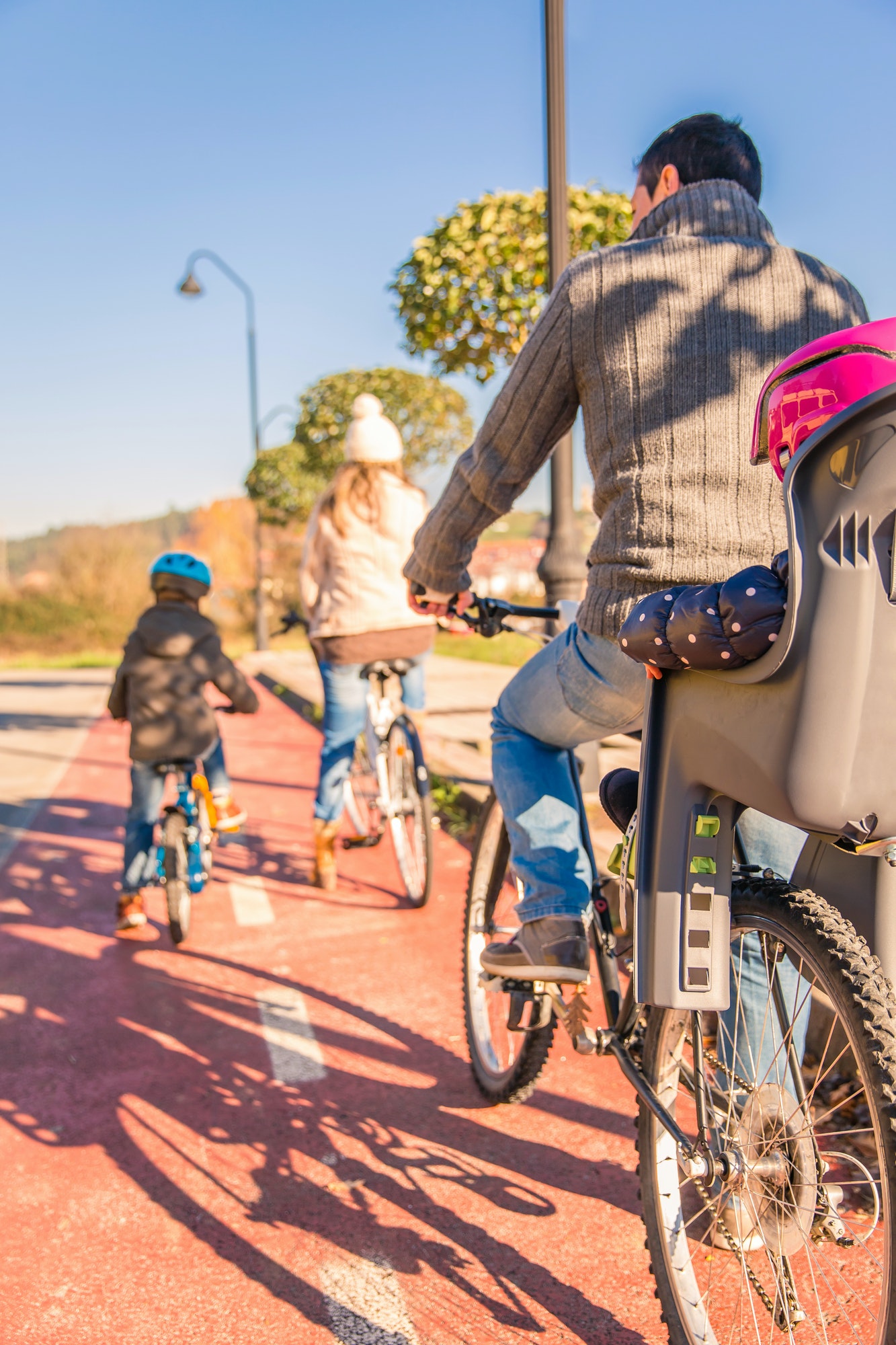 Family with children riding bicycles in the nature