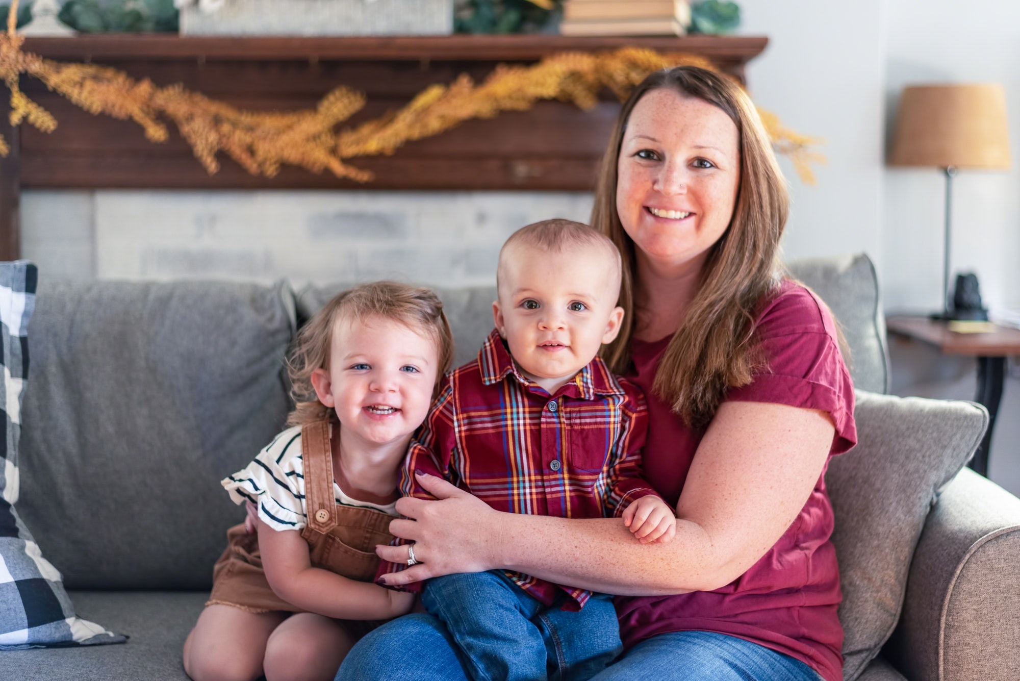 Happy young mother with two toddlers